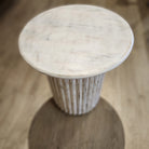 Round mango wood side table with fluted pedestal in a limed finish, made in India