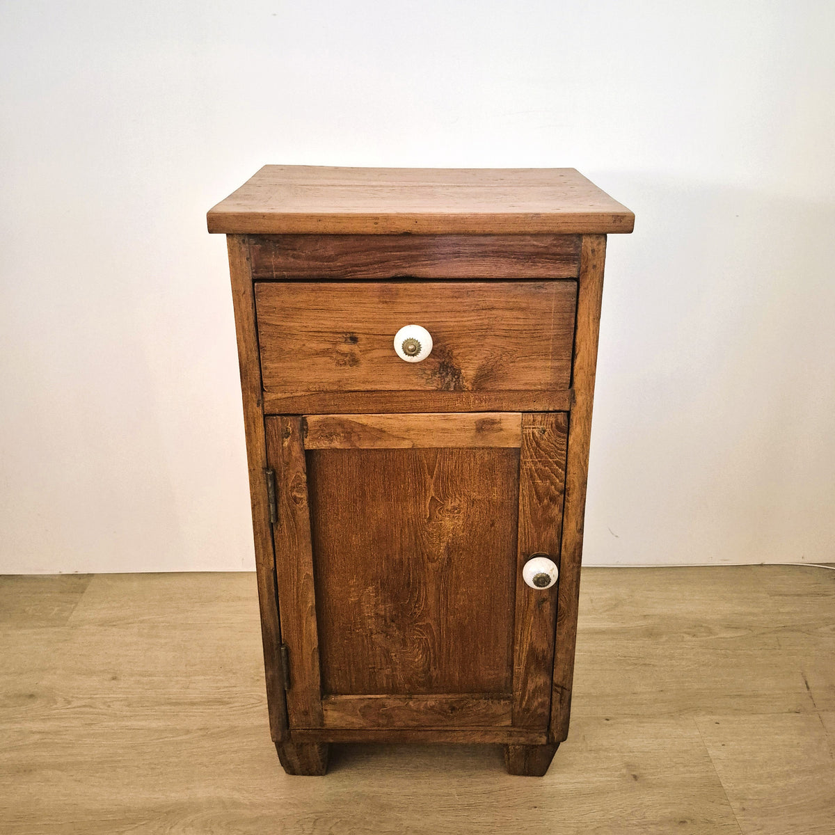 Vintage teak bedside table with a top drawer, a cupboard below and new bone handles, 76 cm high, India