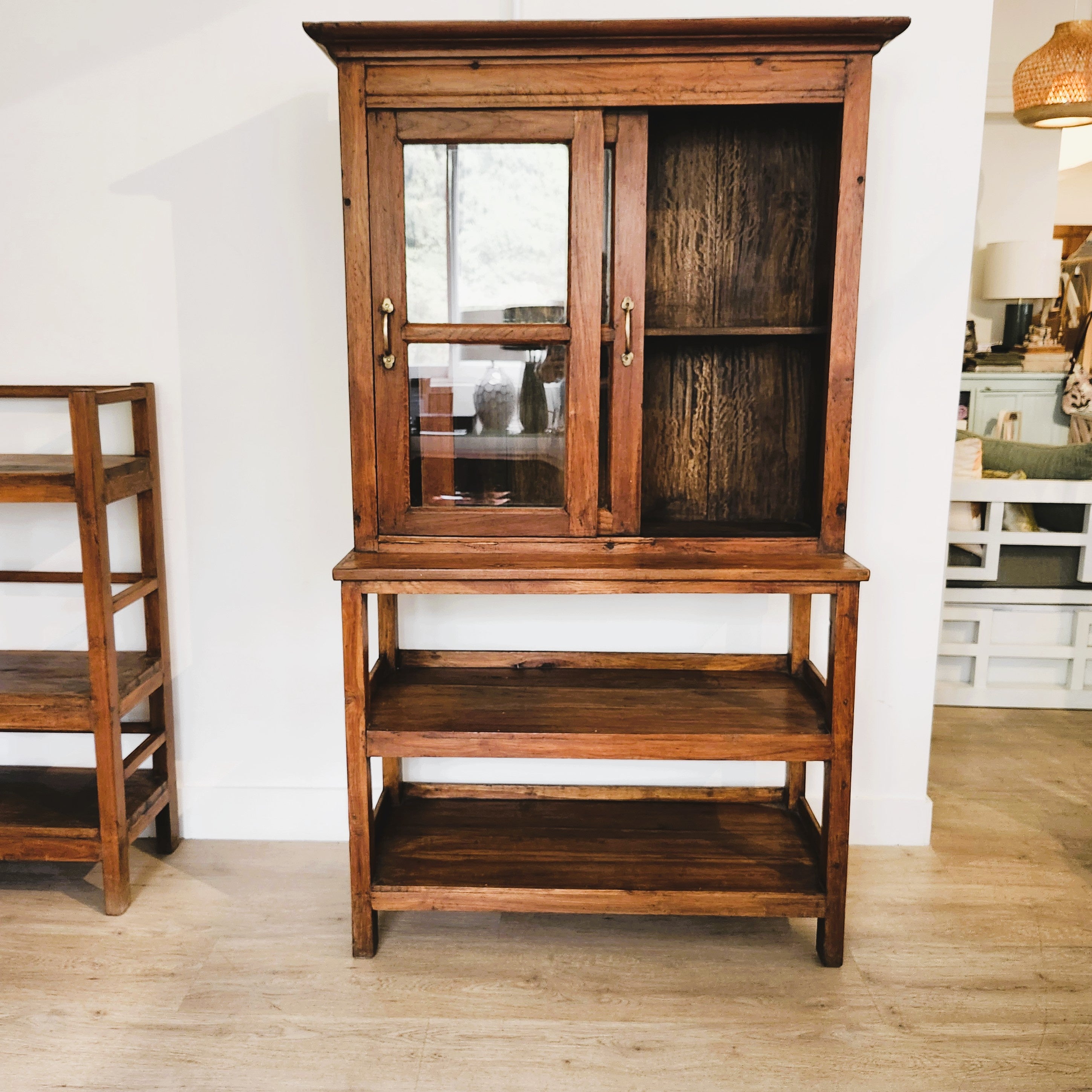 Vintage teak glass-fronted cabinet over open shelf, brass handles, 170 x 97cm