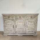 Hand-carved mango wood sideboard with three drawers and a limed finish
