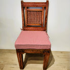 Vintage teak chair in raspberry paint with leaf motif and cushion, 99 x 45.7cm