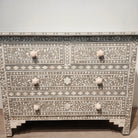 Bone inlay chest of drawers in taupe with a carved leaf design