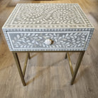 Bone inlay side table with a carved bone knob