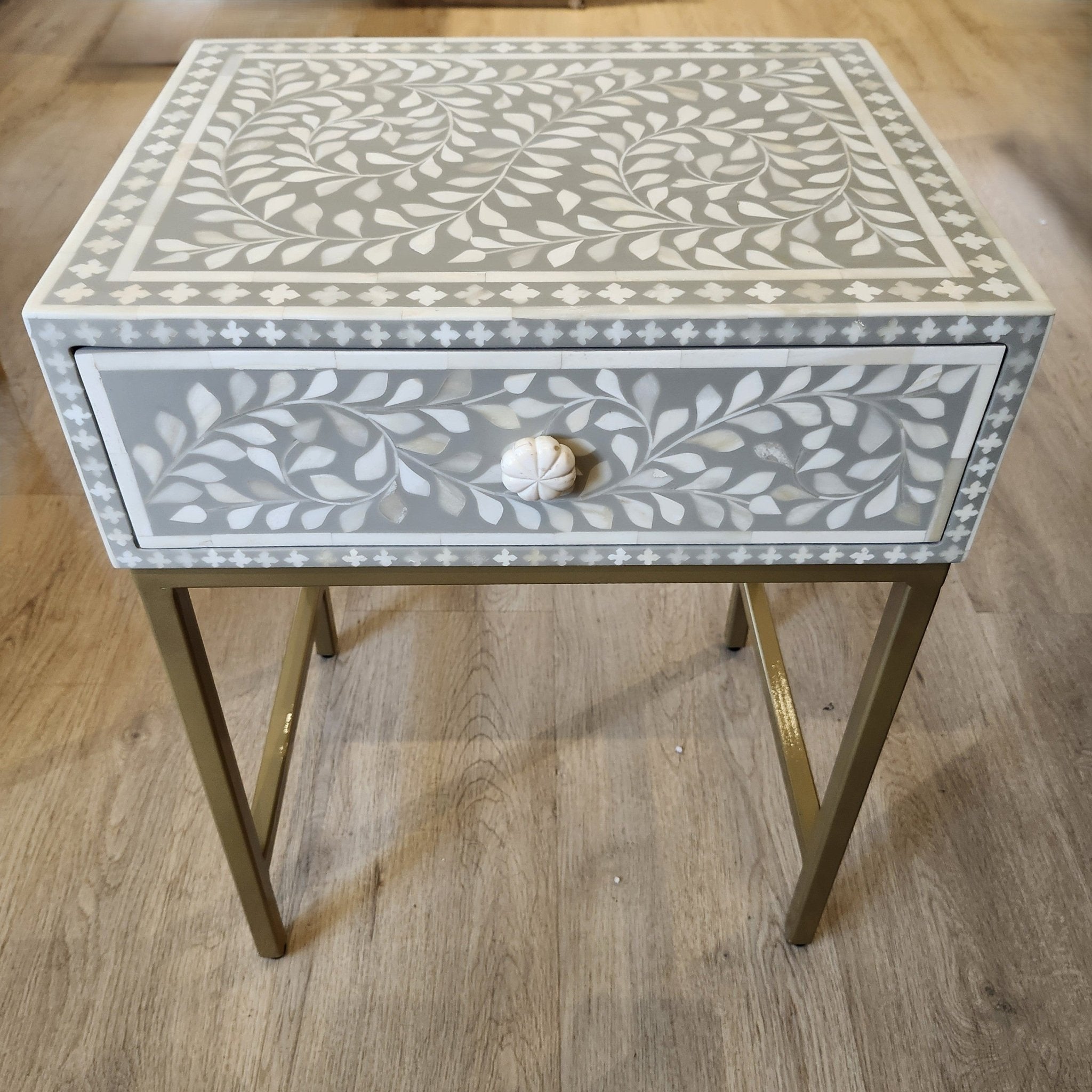 Bone inlay side table with a carved bone knob
