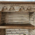 Distressed white teak shelving unit upcycled from old louvred shutters