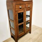 Small teak glass-front cabinet, natural finish, detail