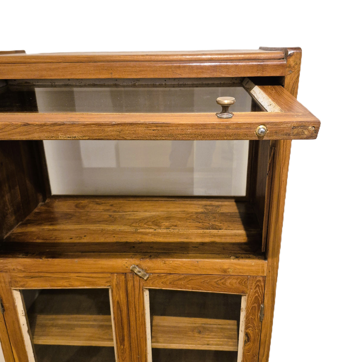 Teak drinks cabinet with an up and over flipper door on the glazed top section, 40 cm high by 60 cm wide