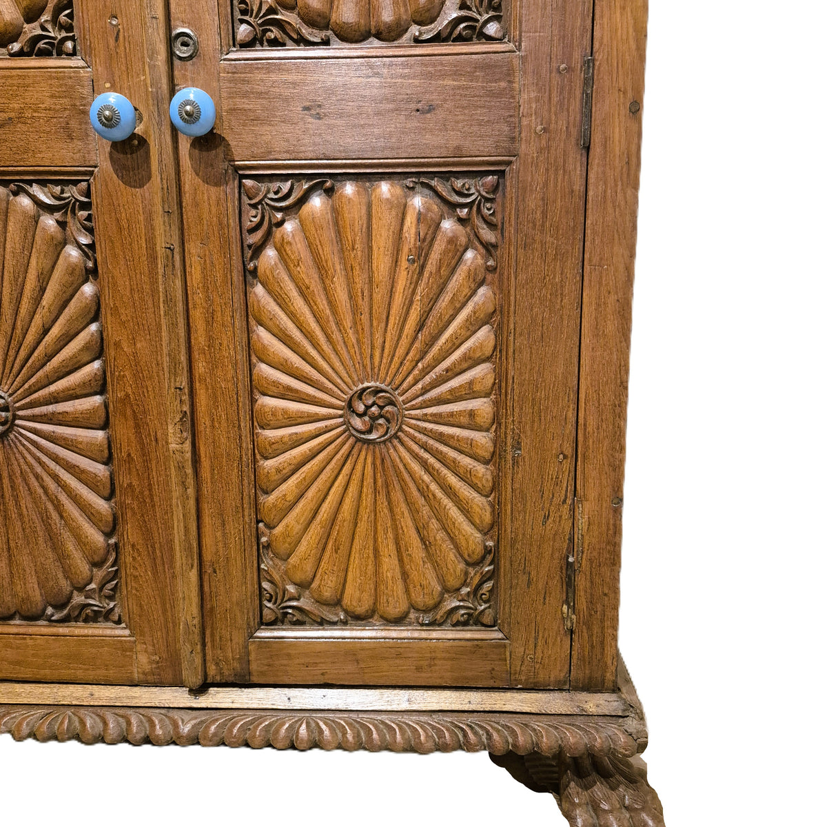 Carved teak cabinet with ceramic door knobs and two carved feet, 105 cm wide and 54 cm deep, from India