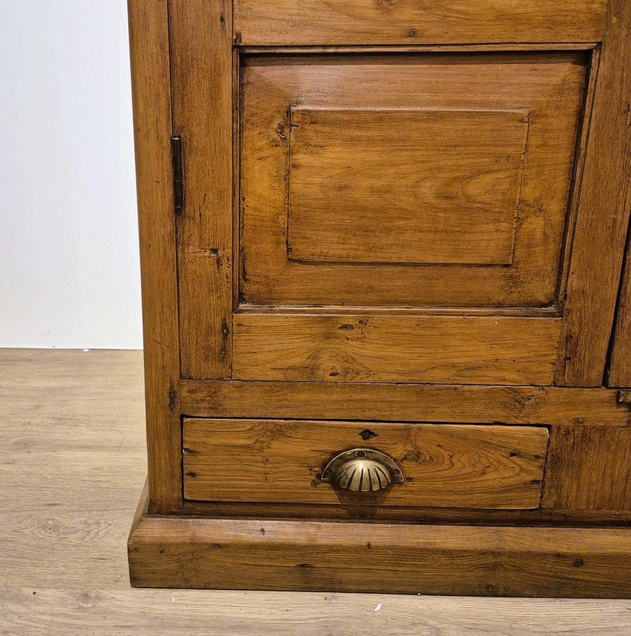 Detail at the top of the vintage teak glass panel cabinet, suited to storing kitchenware, linens, tableware or ornaments