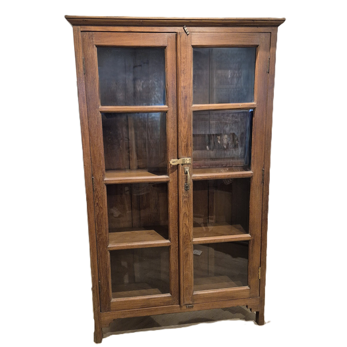 Teak glass fronted bookcase with brass fittings and a natural wax finish, 112 cm wide, made in India