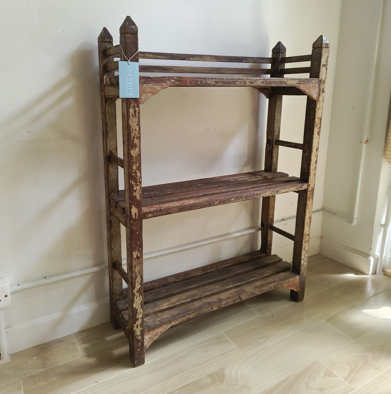 Distressed grey teak shelf unit, vintage woodwork, styled