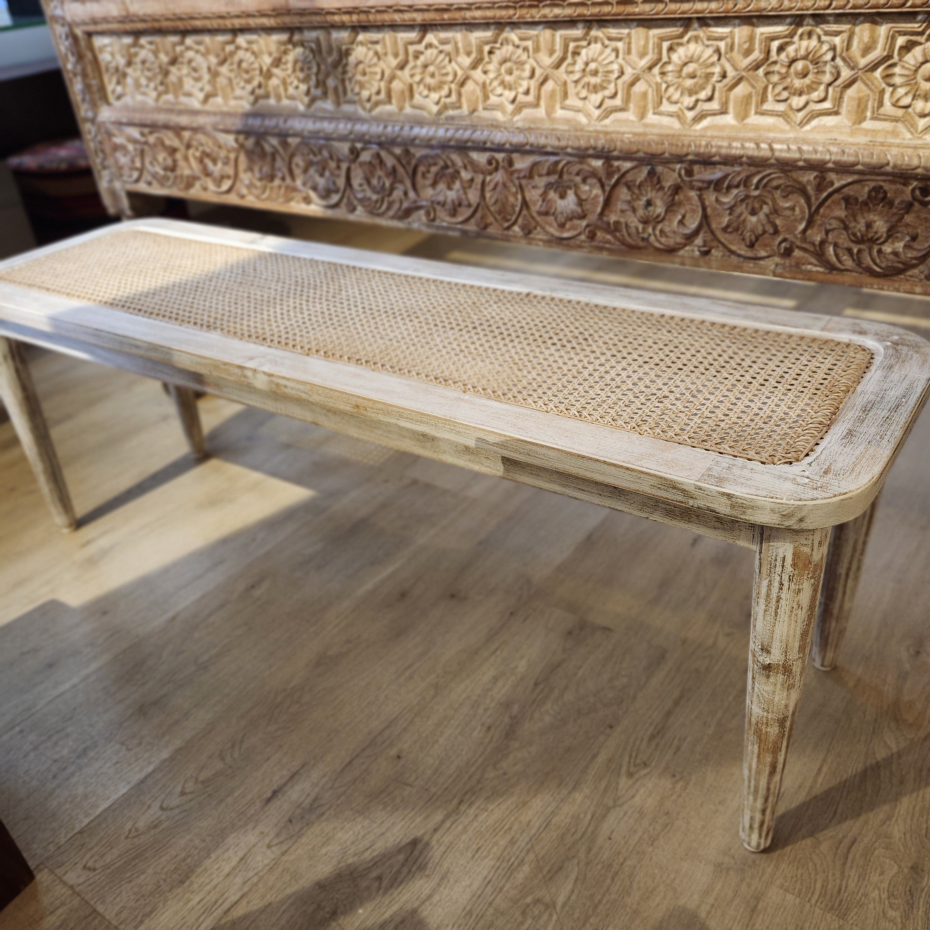 Mango wood bench with a woven cane top