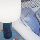 Blue lacquer table lamp with white drum shade, detail view