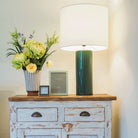 Green lacquer table lamp with white drum shade, detail view