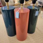 Lacquer table lamp shown in three colours, with white drum shade, 66 cm high