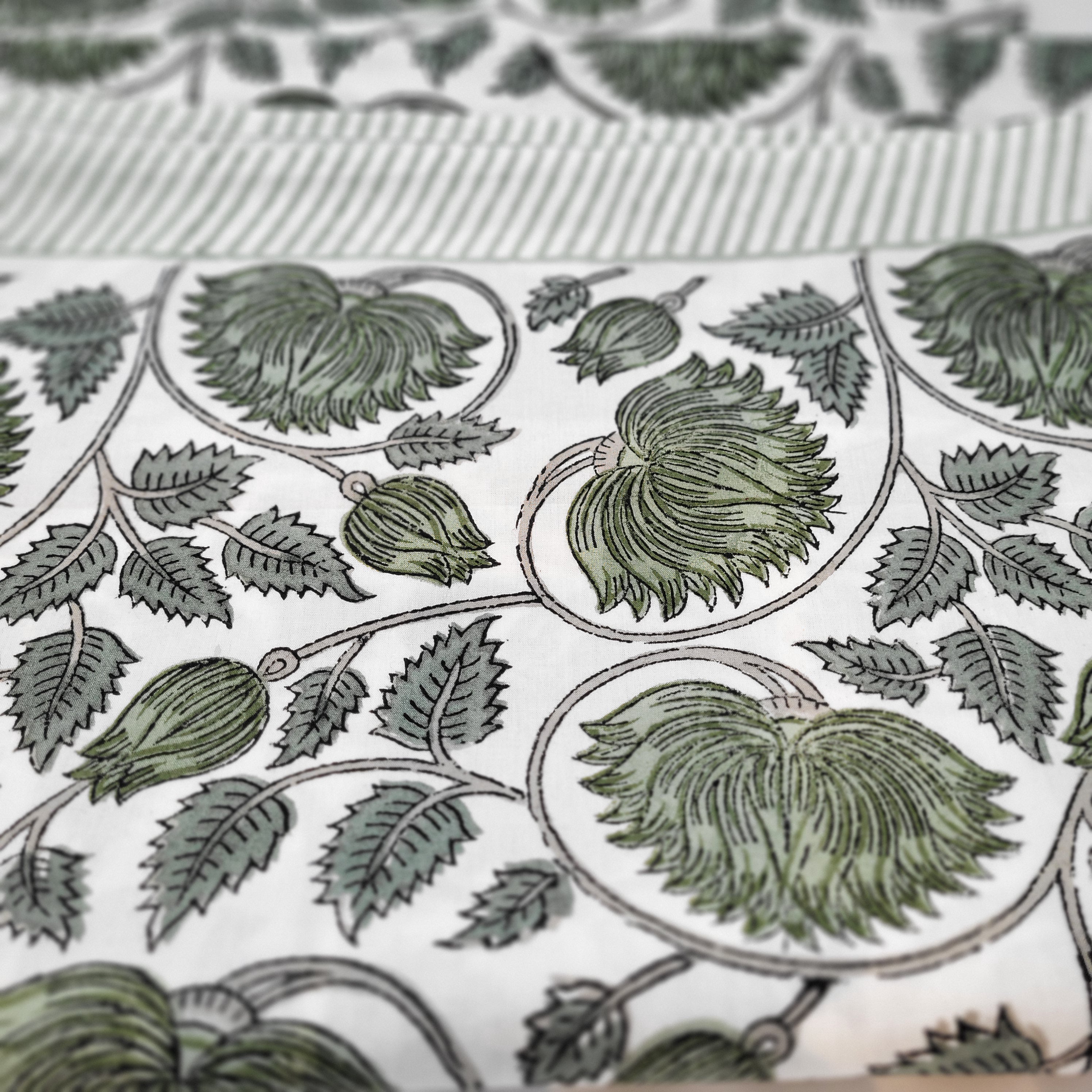 Lotus block-print cotton tablecloth in sage on white