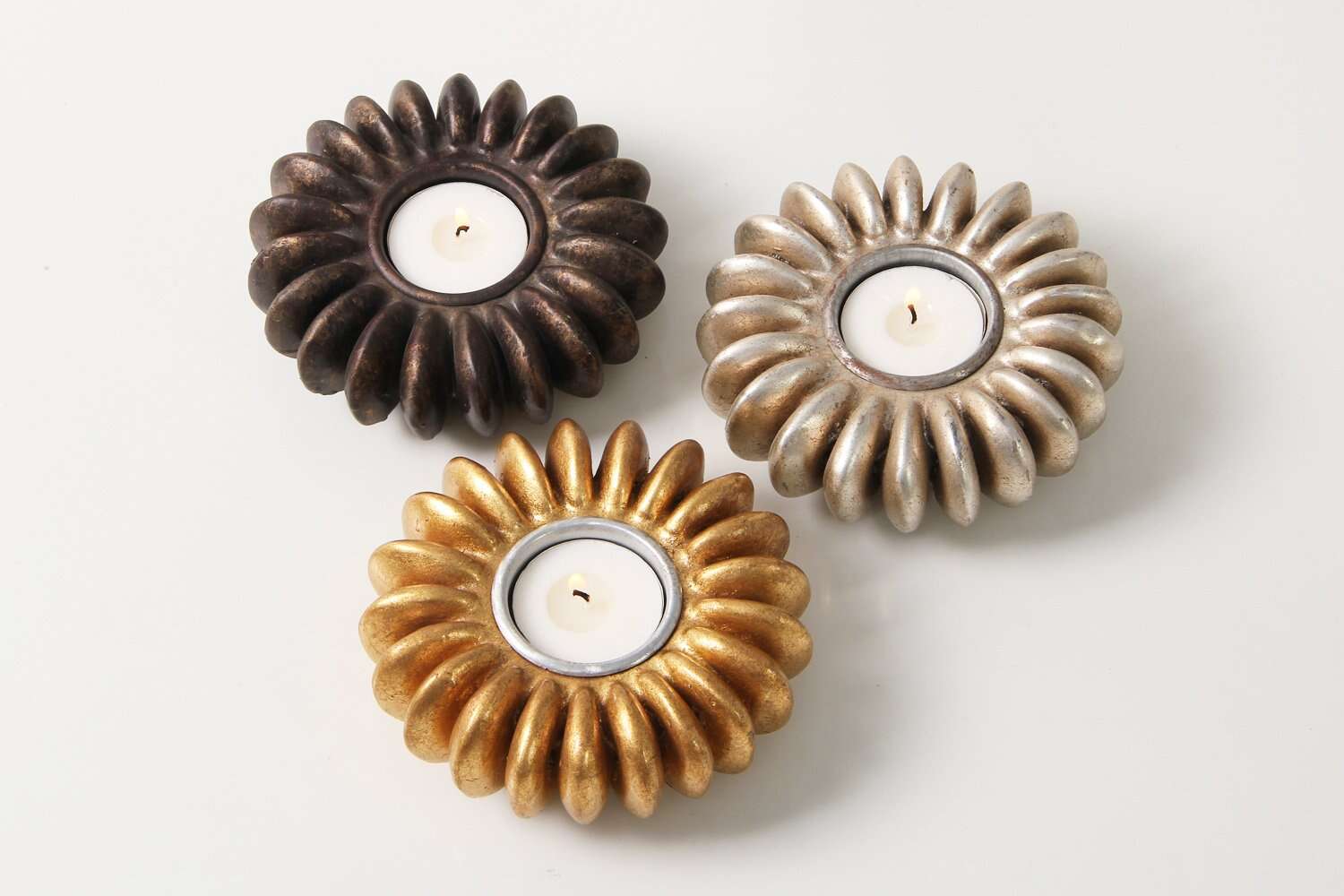 Gold seed tea light holder, seed-pod design, styled view
