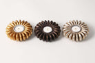 Bronze seed tea light holder, seed-pod design, styled view