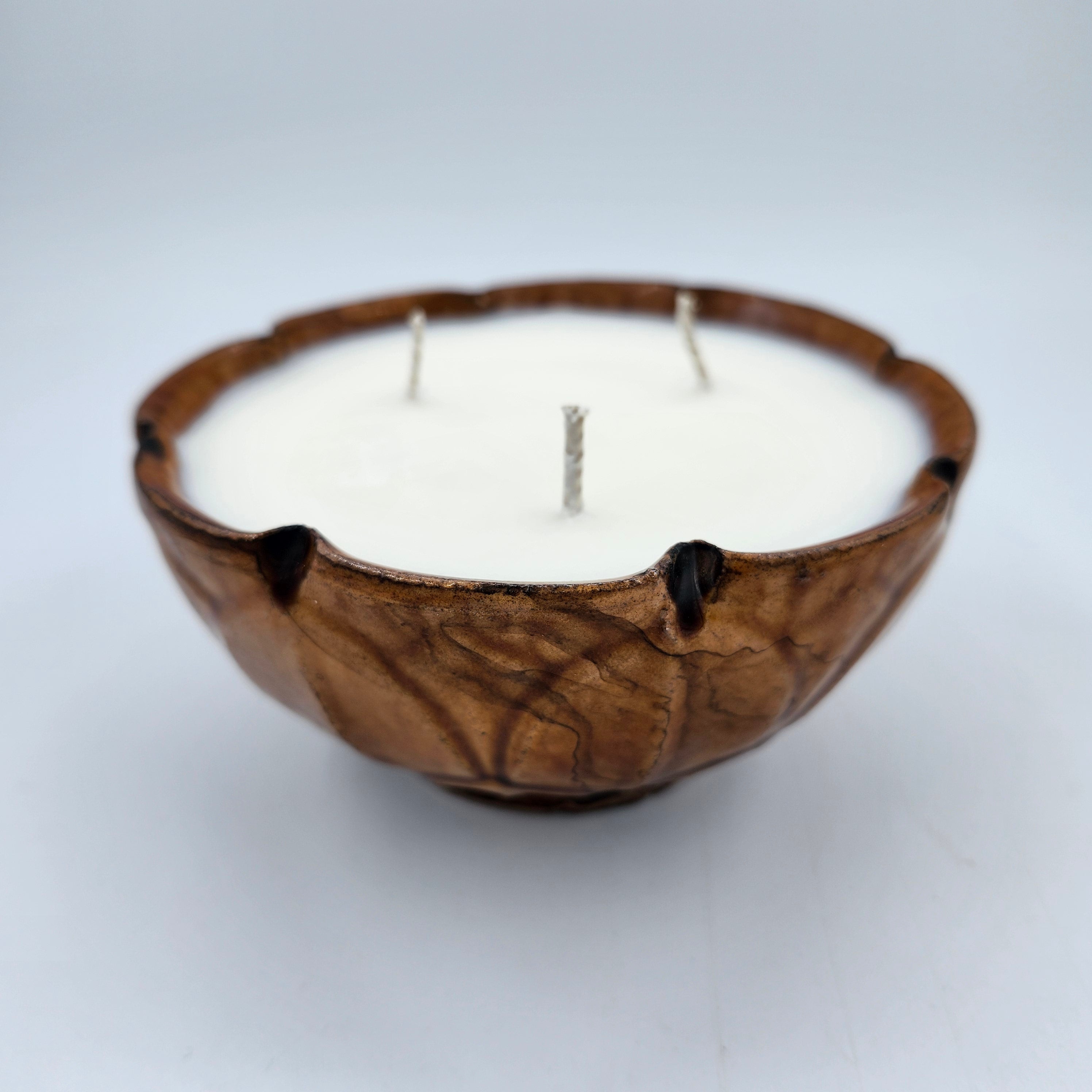 Amber Leaves scented candle in rich amber bowl with leaf pattern, organic soy wax