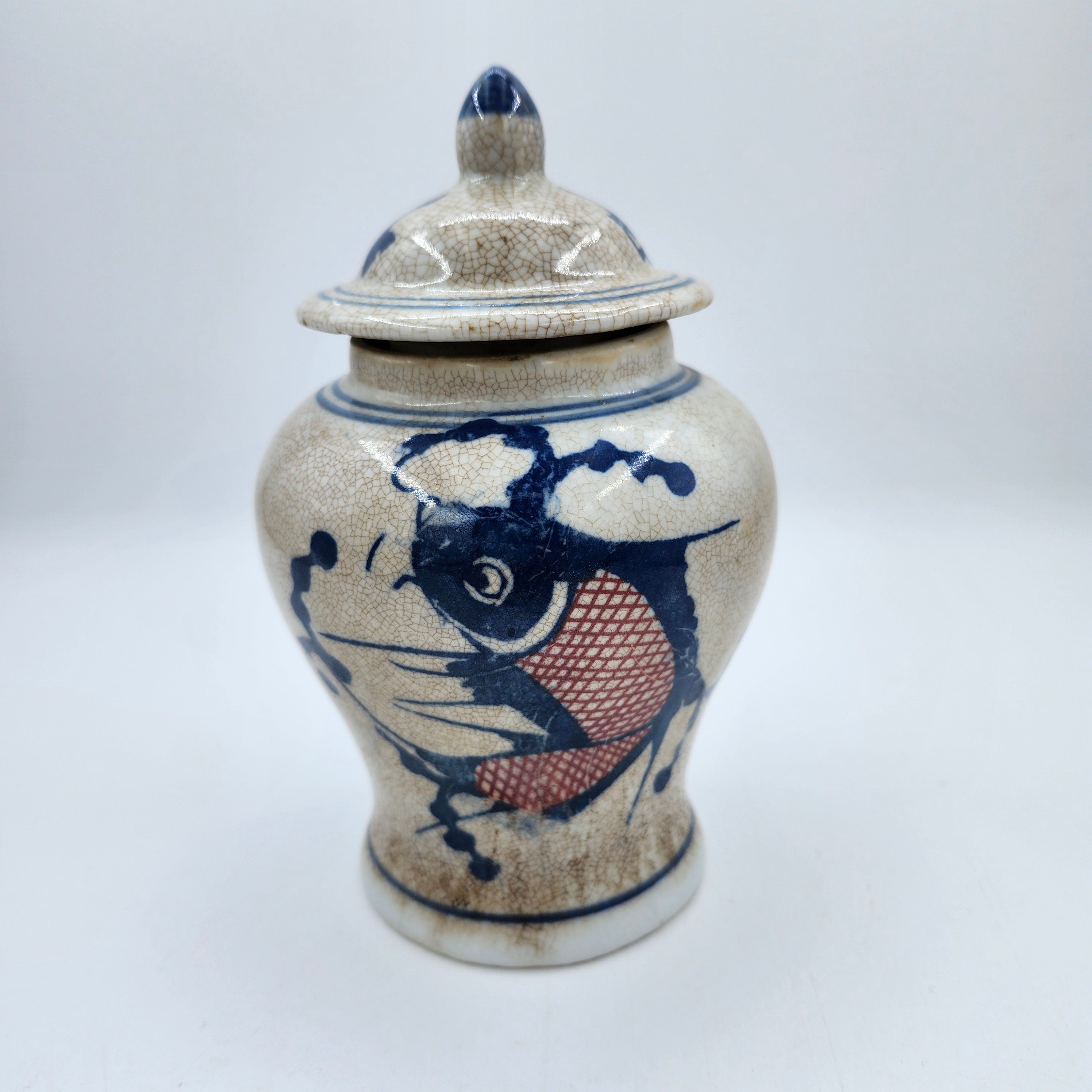 Catfish candle, painted ceramic temple jar, detail