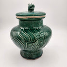 Jade Fish scented candle, deep green vase with fish motif and dog's head lid, organic soy wax