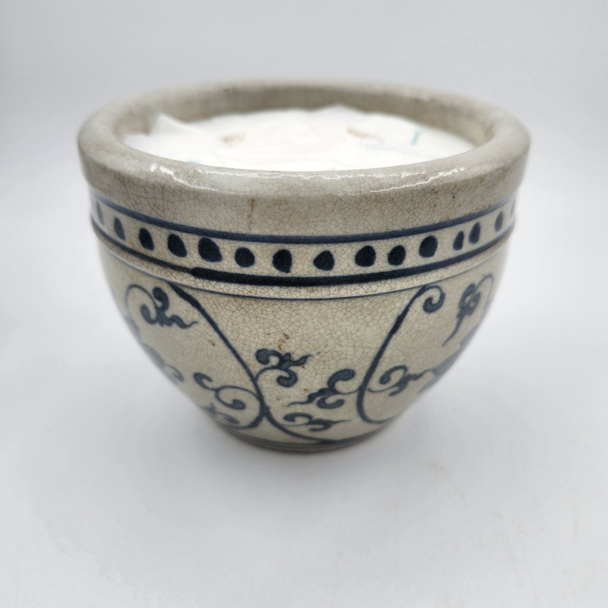 Dots scented candle, rustic ceramic pot with dots around the rim, Mui Wo scent