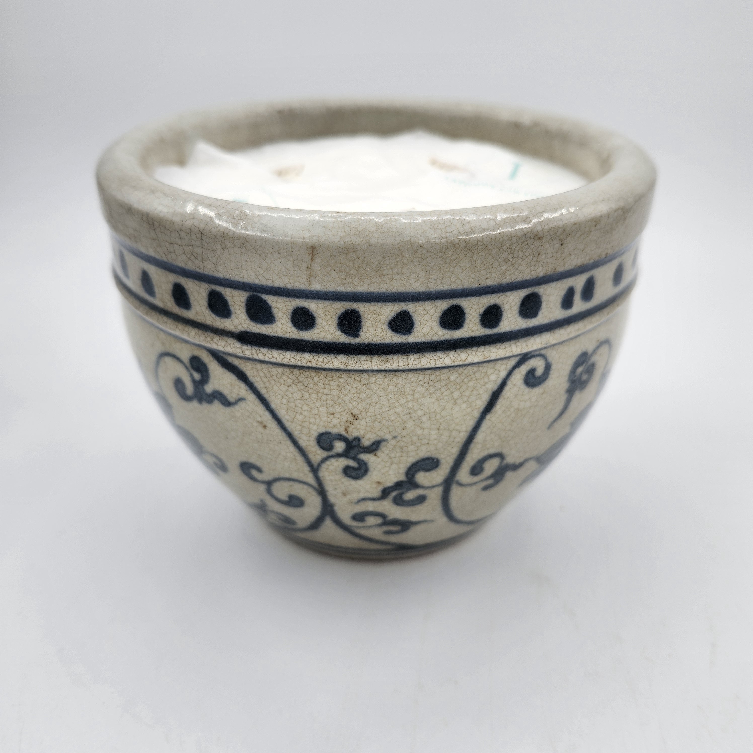 Dots scented candle, rustic ceramic pot with dots around the rim, Mui Wo scent