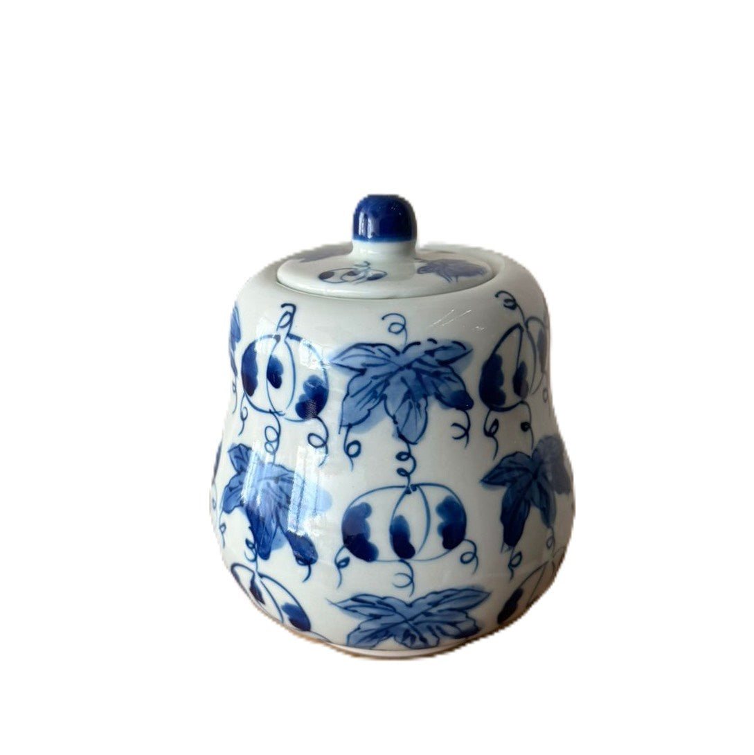 Abundance scented candle in blue and white curved ceramic pot with lid, Mui Wo scent