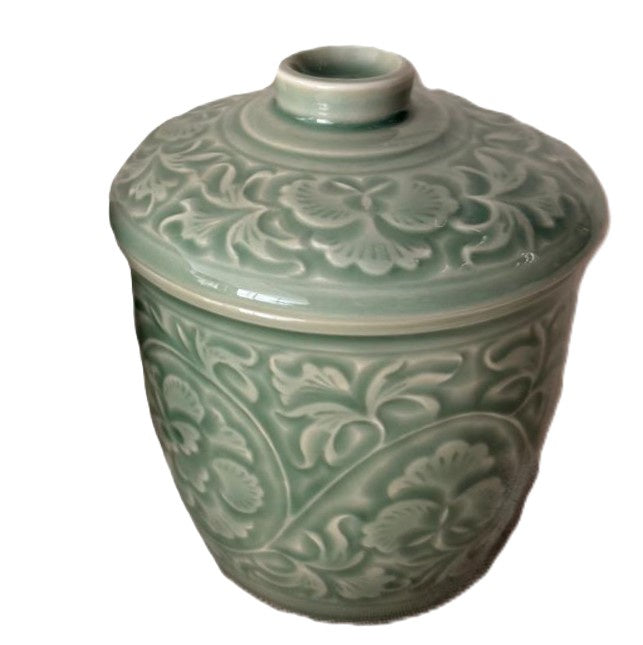 Celadon Jacquard candle, upcycled celadon pot, styled view