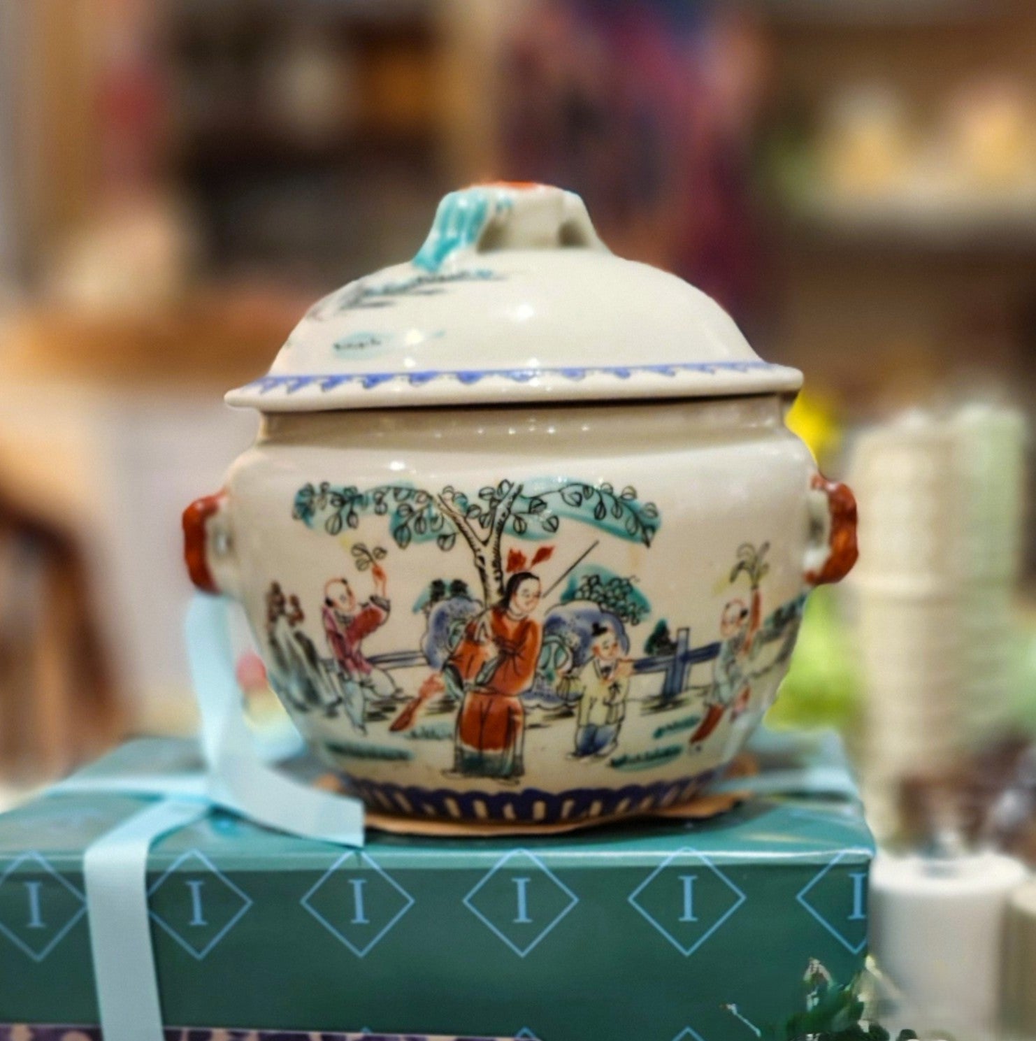 A Journey Begins soy wax candle in painted ceramic jar, styled view