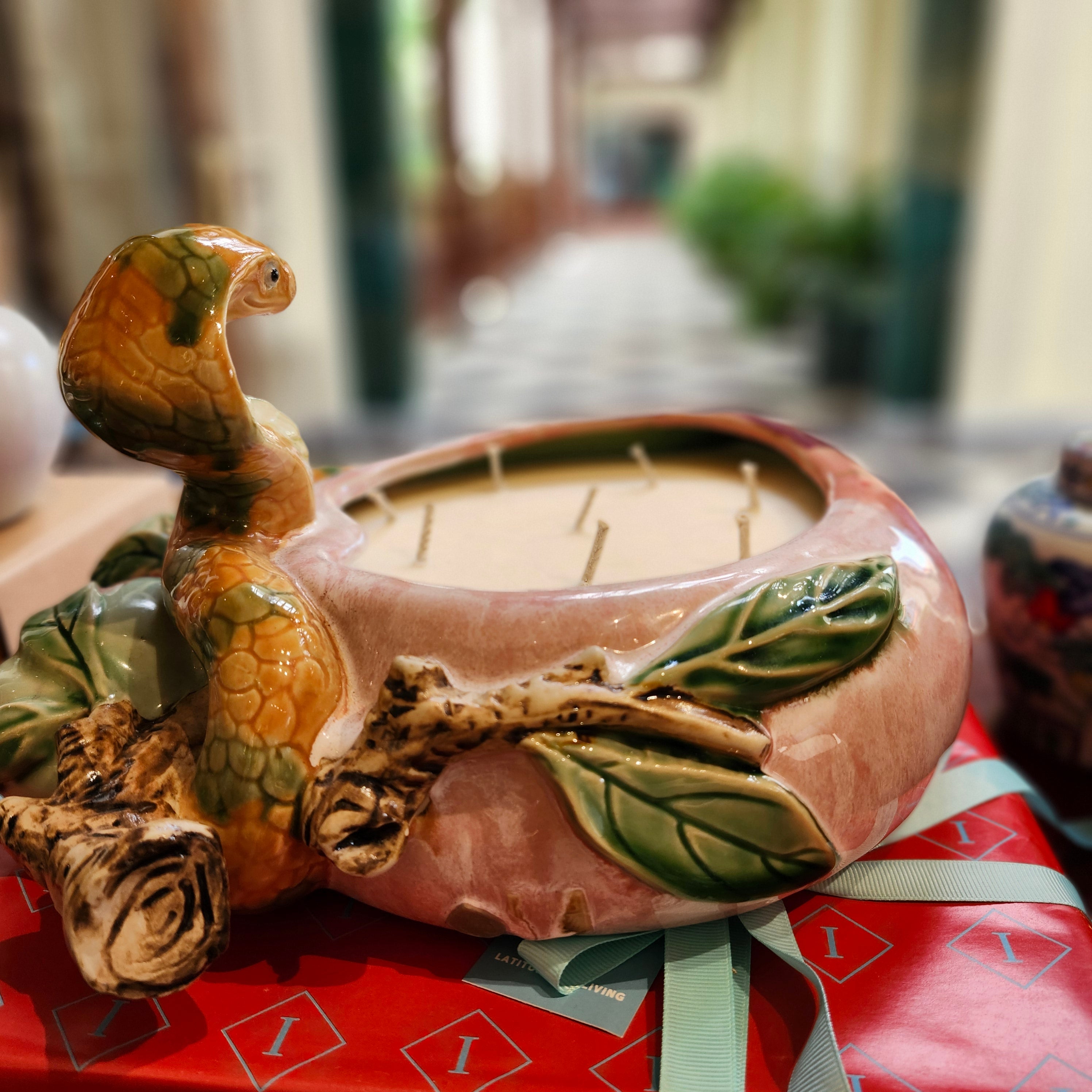 Legend scented candle, large ceramic jar painted with a snake, plums and peaches, Tiger's Head scent