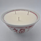 Luck candle, red character on ceramic bowl, three wicks, detail