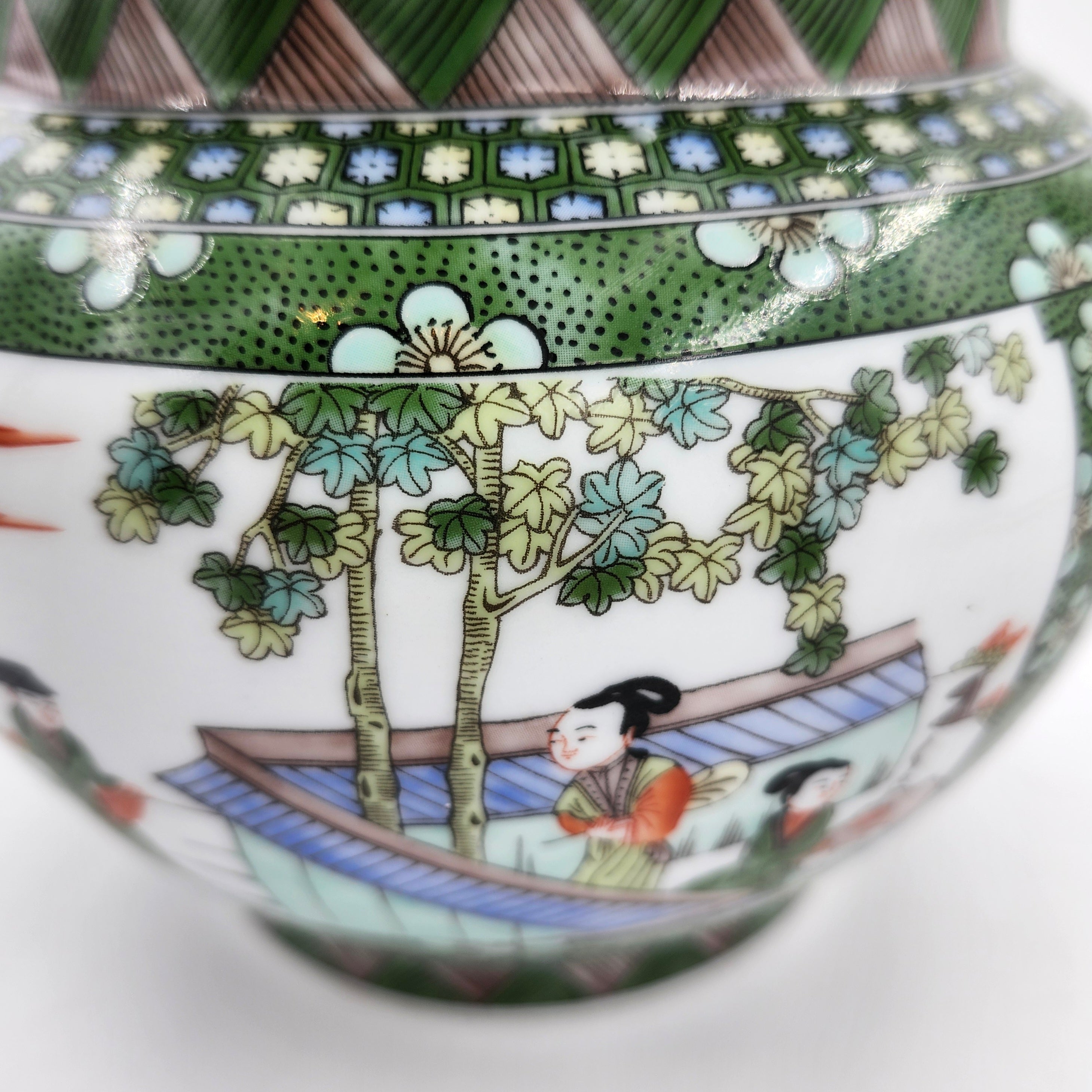 Mandarin candle, hand-painted Chinese scenes on ceramic jar, styled view