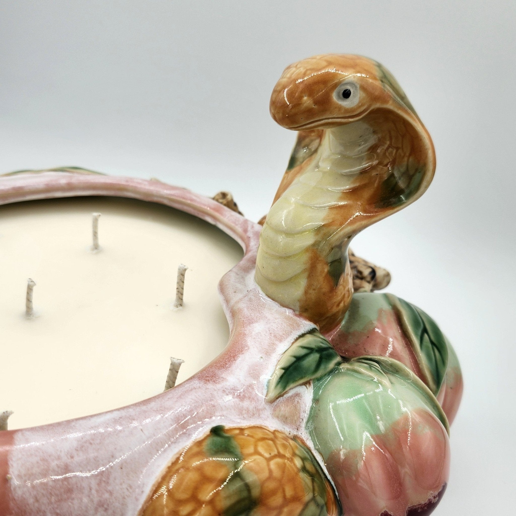 Legend candle, hand-painted snake and peach design, detail