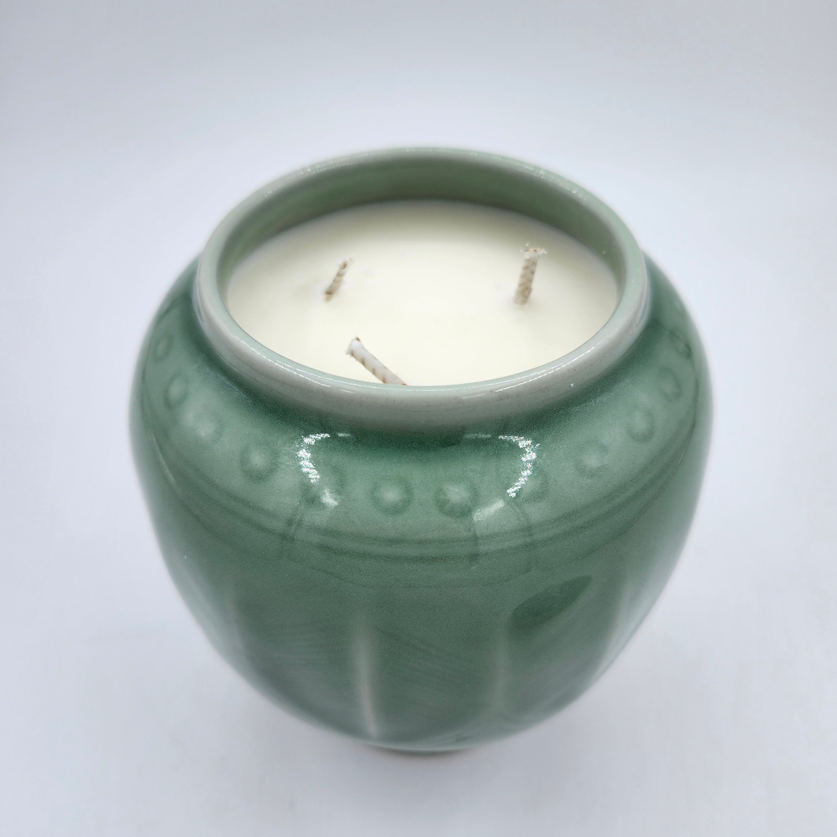 Wisdom candle, celadon pot with tortoise knob, detail