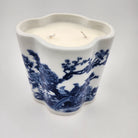White ceramic scented candle with blue floral and bird pattern on a white background