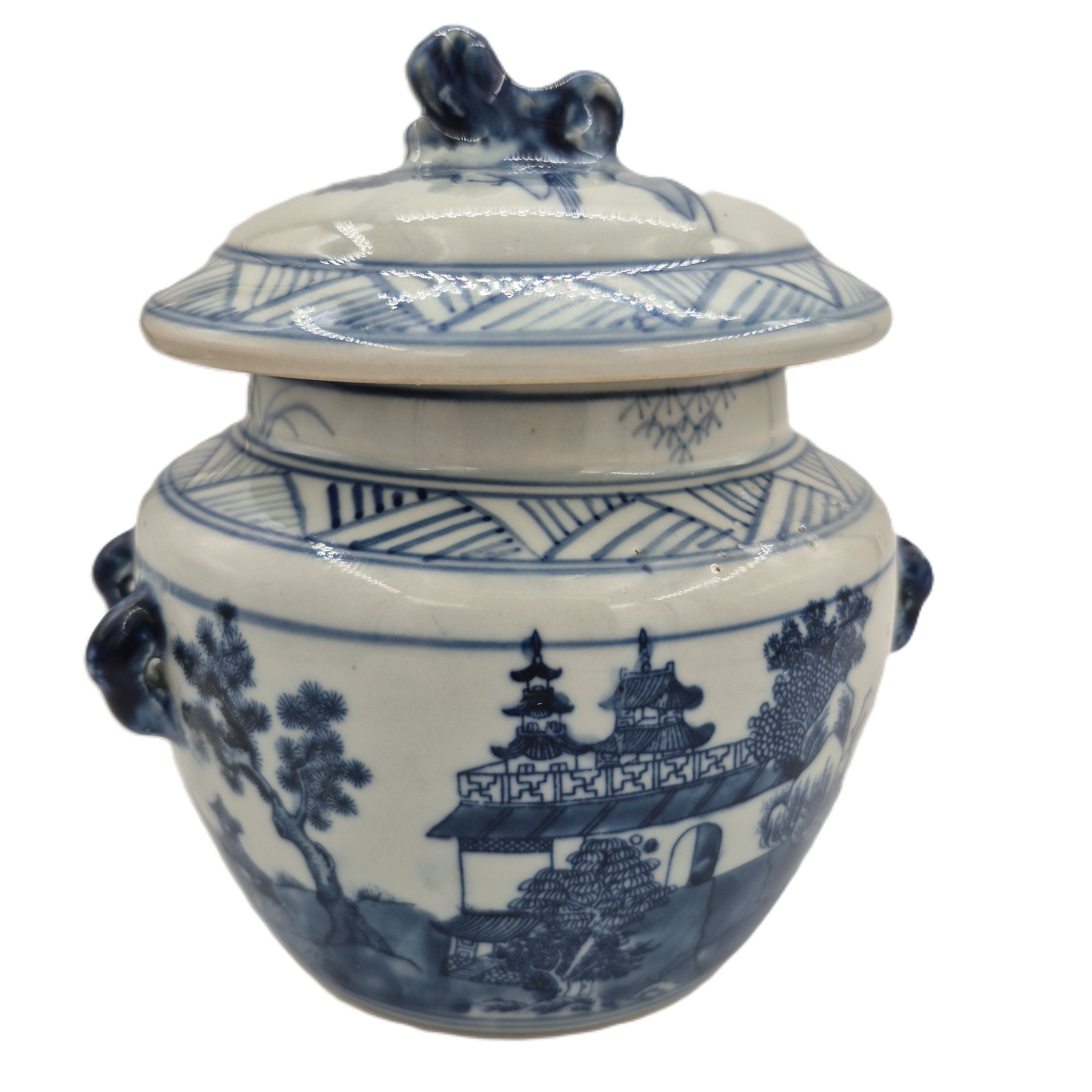 Scented Candle in a blue and white ceramic jar with lid on a white background