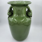 Vintage vase in plain green glaze with fruit and flower neck detail, 32cm high