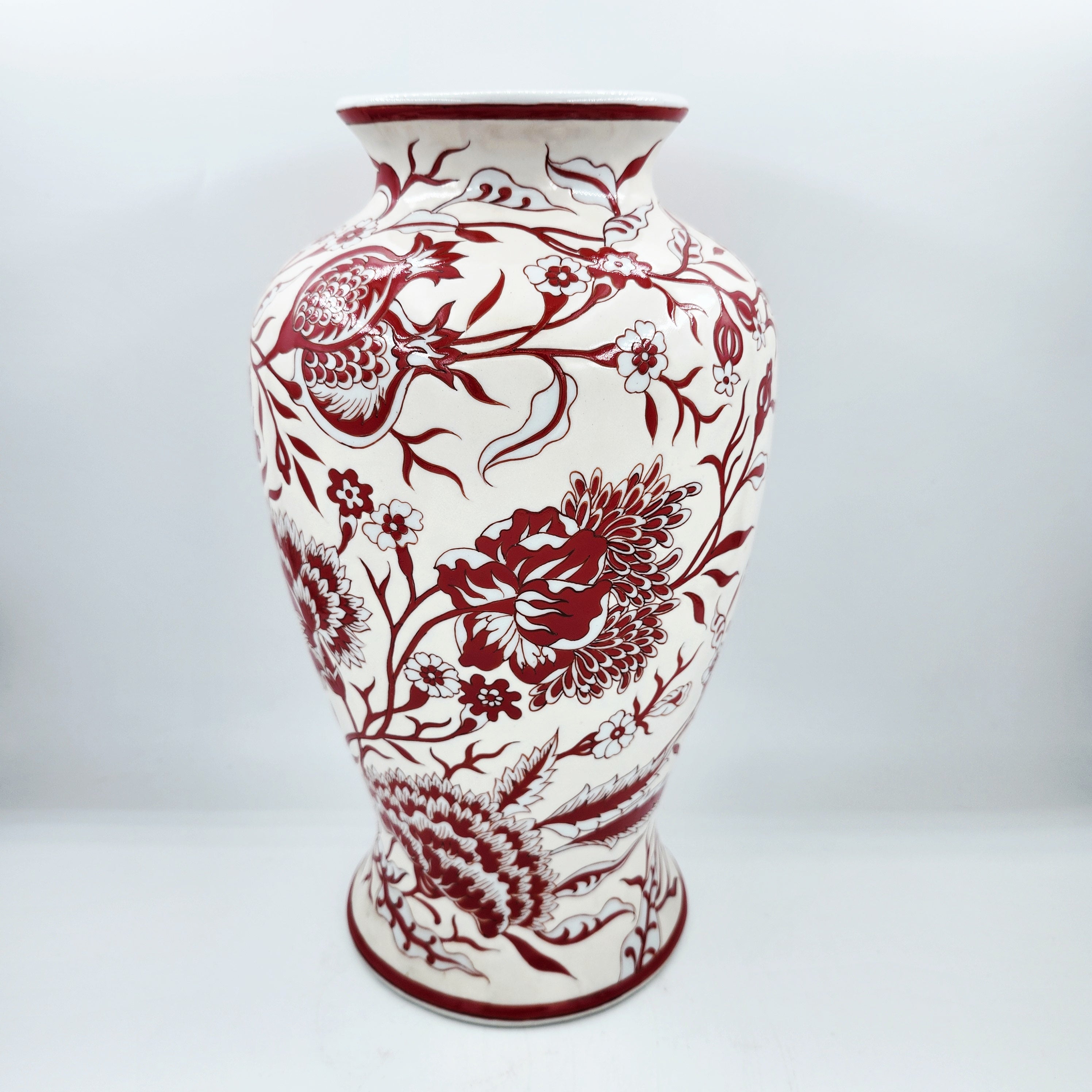 Porcelain vase with red and white flowers and pomegranates on cream, 32cm high