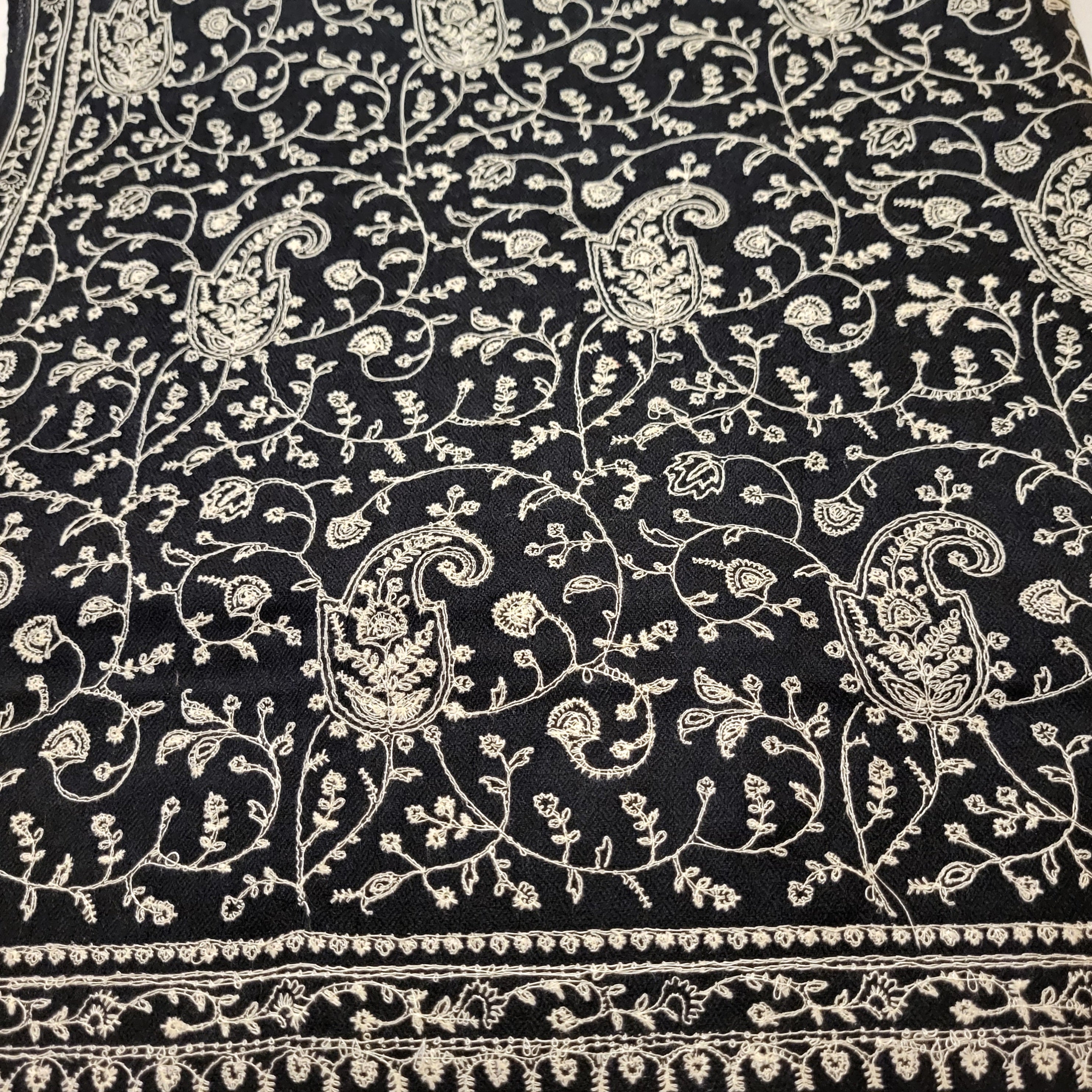 White paisley embroidery on black pashmina, lightweight, detail view