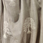 Grey pashmina embroidered with a tree motif in white contrast thread, 107 by 210 cm, hand wash or dry clean
