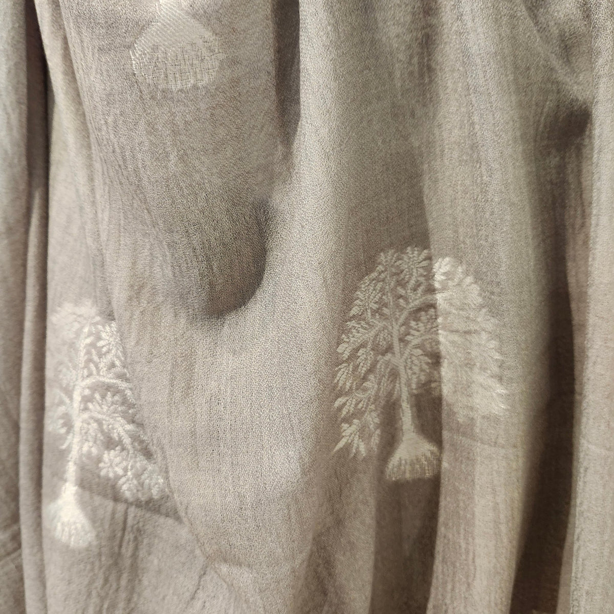 Grey pashmina embroidered with a tree motif in white contrast thread, 107 by 210 cm, hand wash or dry clean
