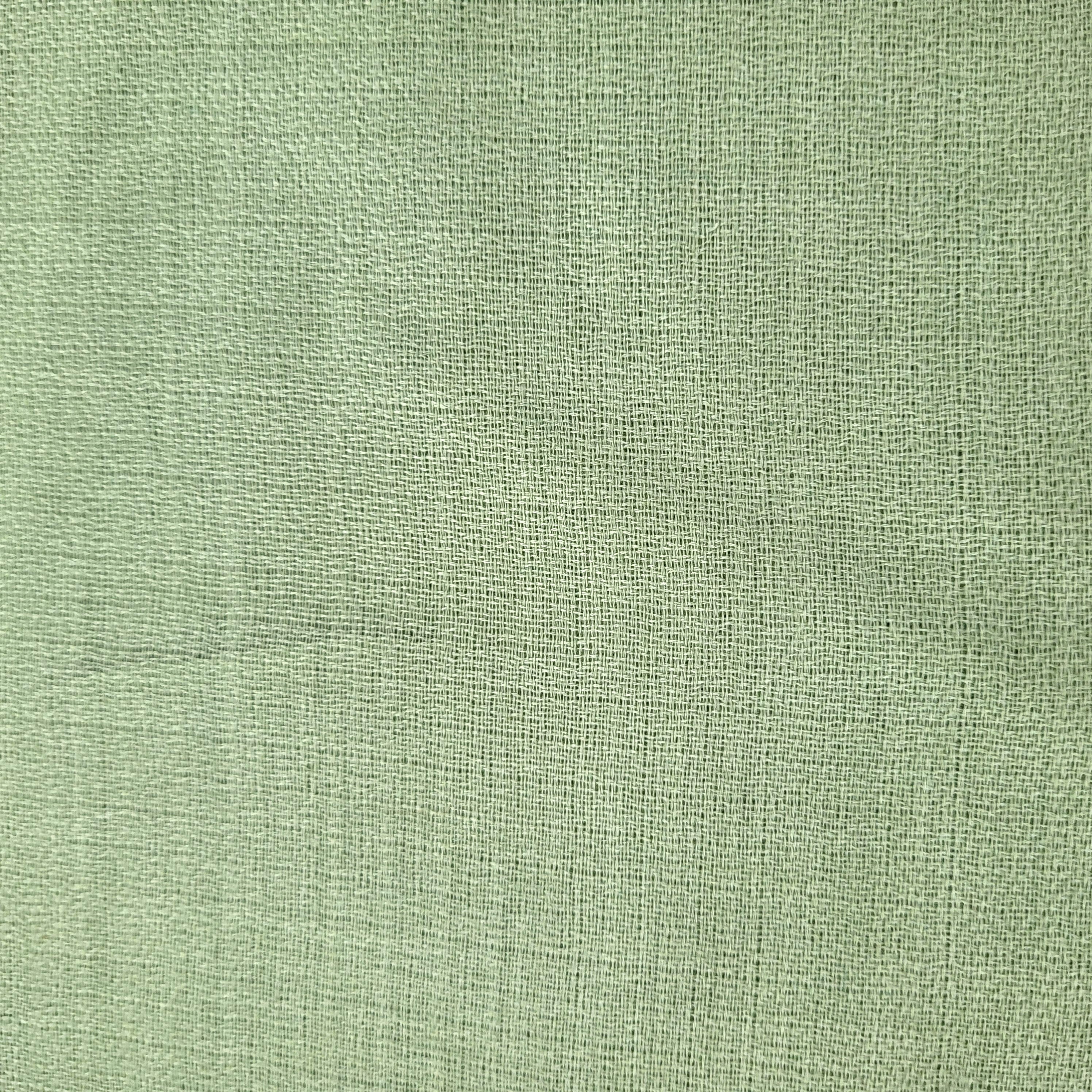 Plain 100% pashmina shawl in soft pistachio green, finely woven, lightweight to wear around the neck