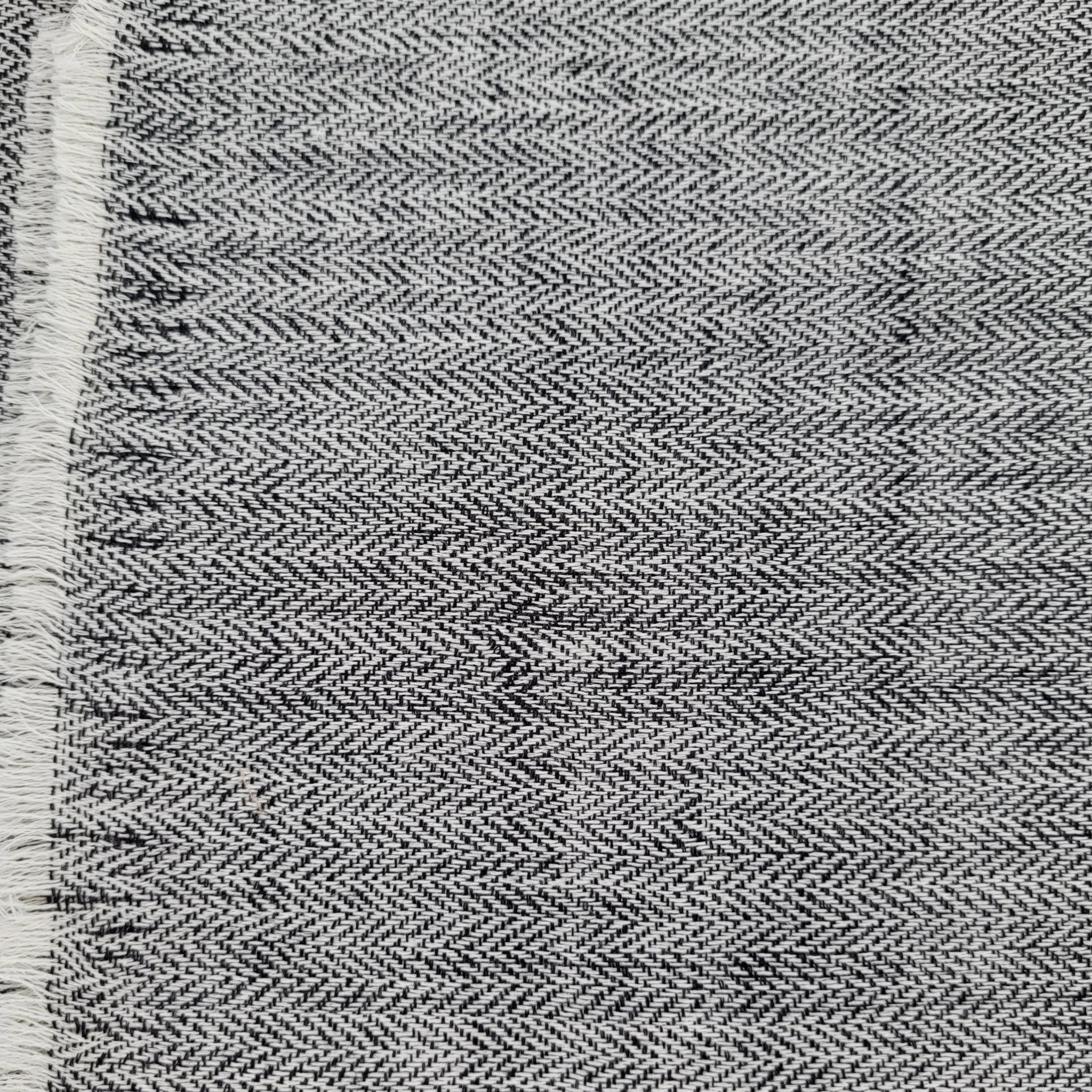 Plain 100% pashmina shawls shown in black and white colourways, soft, finely woven and lightweight to wear