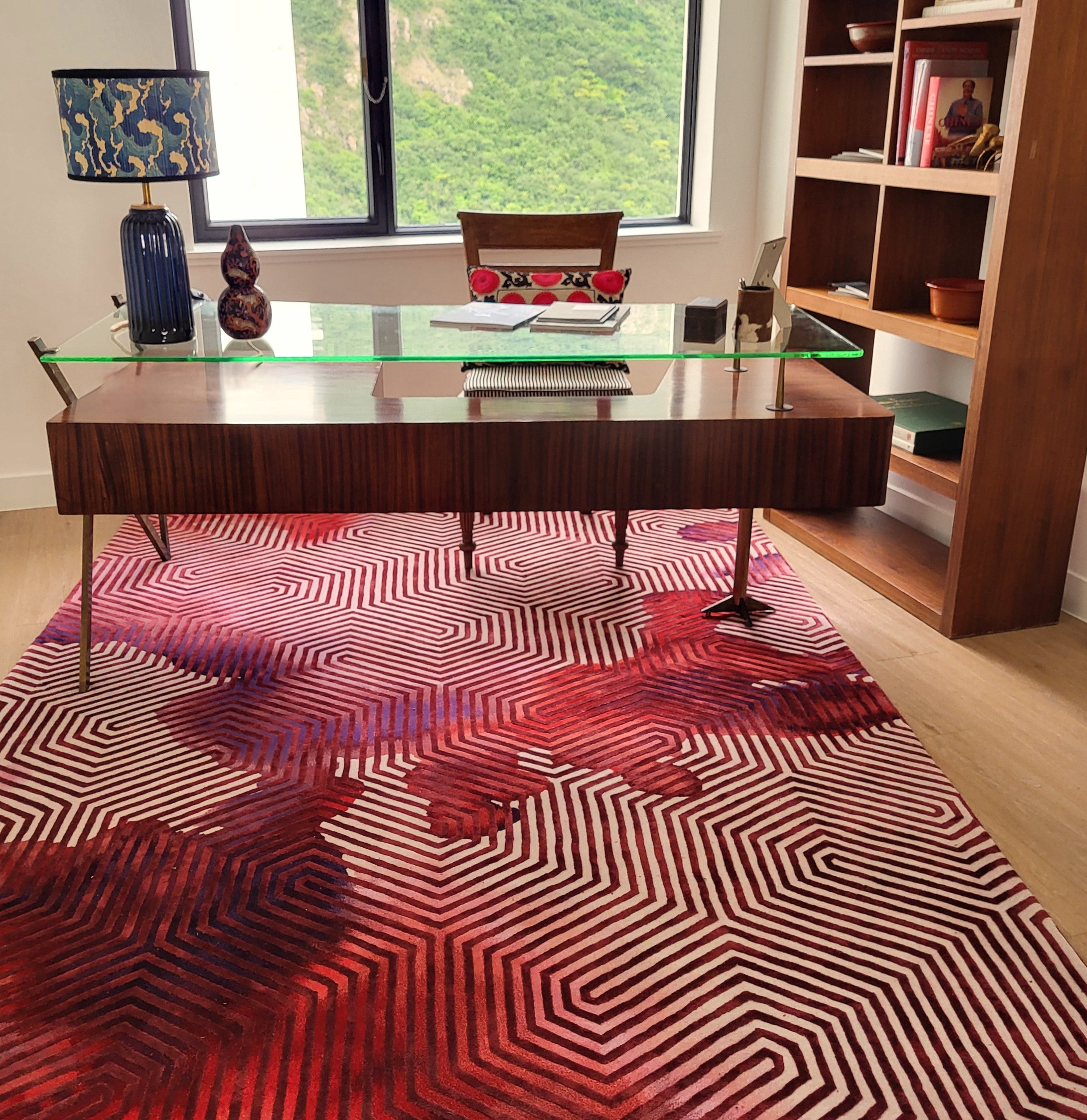 Mid-century glass-top executive desk with six drawers, styled