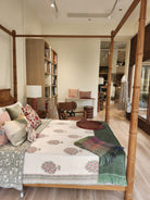 Vintage queen size four poster bed with bamboo-effect turned posts and curved headboard