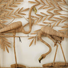 Flamingo screen by Maria Lopez Torres, rattan and brass with two flamingos on a palm background