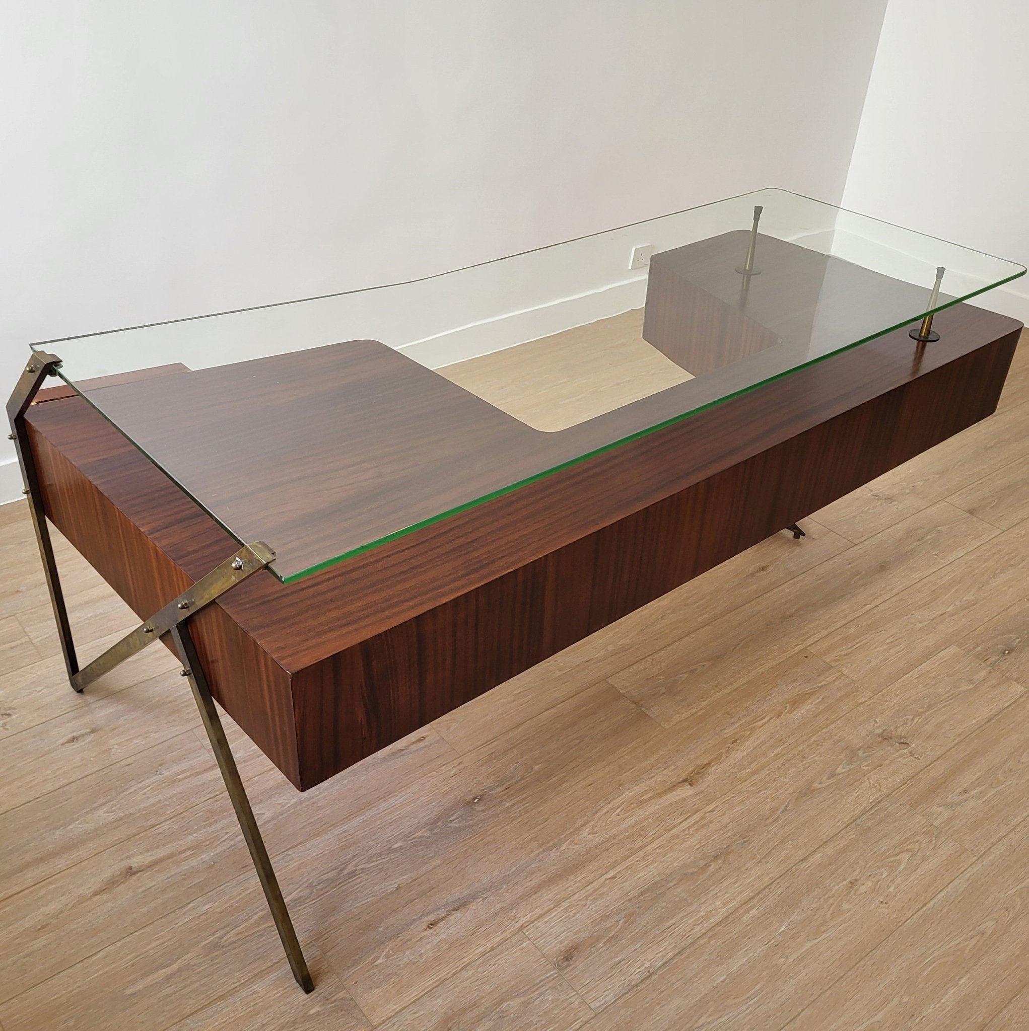 Mid-century Italian executive desk, glass top on wooden pedestal with brass frame