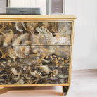 Églomisé chest of drawers side view showing gold-leaf glass panels, 78.5 x 48 x 72 cm