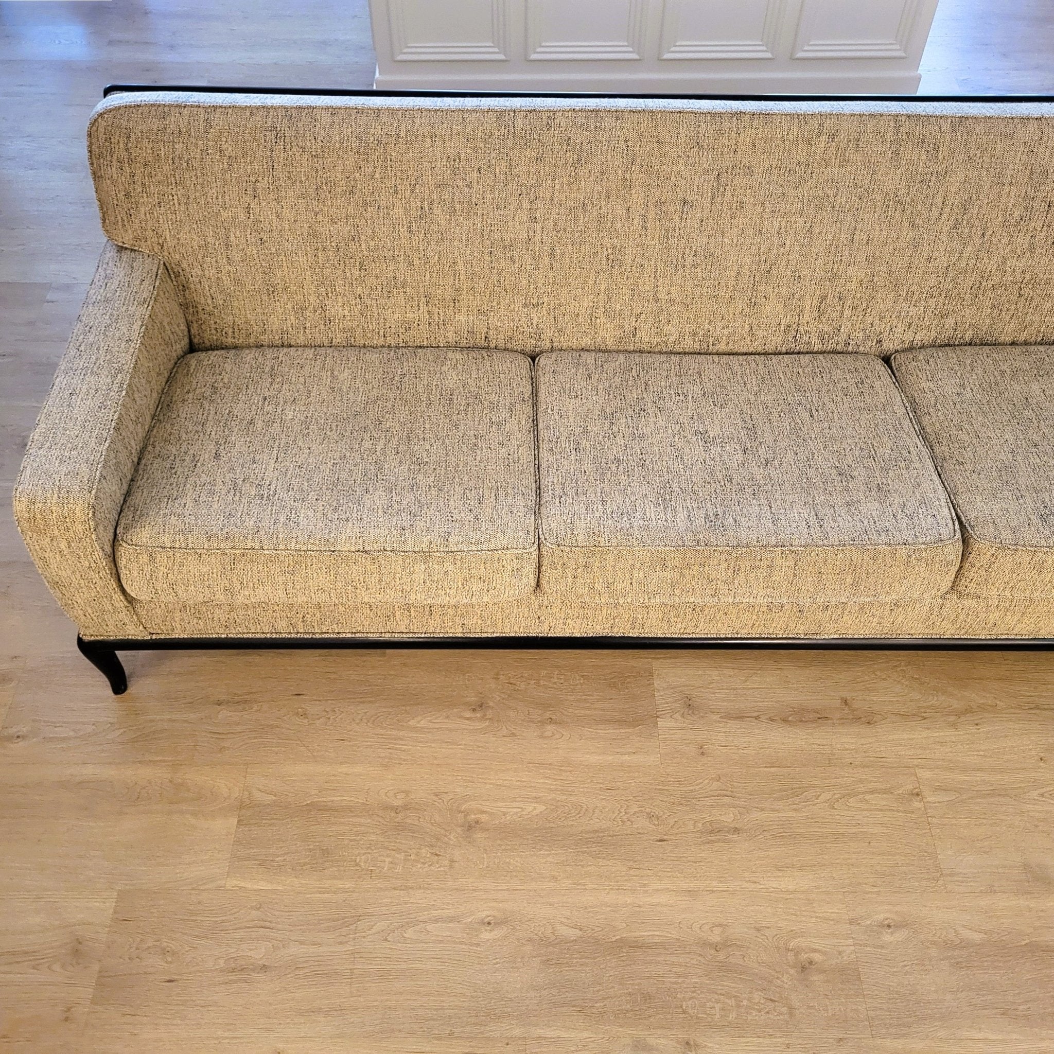 T H Robsjohn-Gibbings three-seater sofa, reupholstered, wood frame